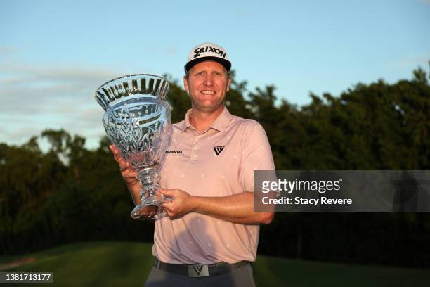 Ryan Brehm poses with the trophy on the 18th green during the final round of the Puerto Rico Open at Grand Reserve Golf Club on March 06, 2022 in Rio...