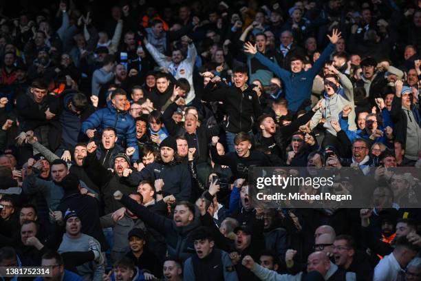 Manchester City fans celebrate their first goal during the Premier League match between Manchester City and Manchester United at Etihad Stadium on...