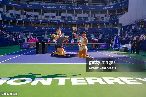 Catherine Harrison and Sabrina Santamaria of United States pose with the champions trophy after winning the doubles final match as part of the GNP...