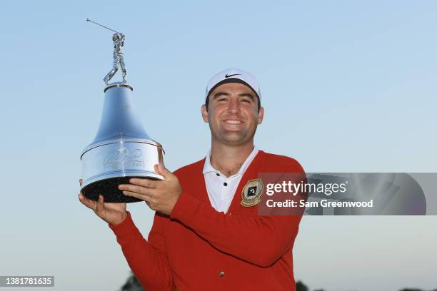 Scottie Scheffler of the United States poses with the trophy after winning the Arnold Palmer Invitational presented by Mastercard at Arnold Palmer...