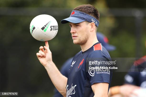 Luke Keary spins a ball on his finger during a Sydney Roosters NRL training session at Robertson Road Synthetic Field on March 07, 2022 in Sydney,...