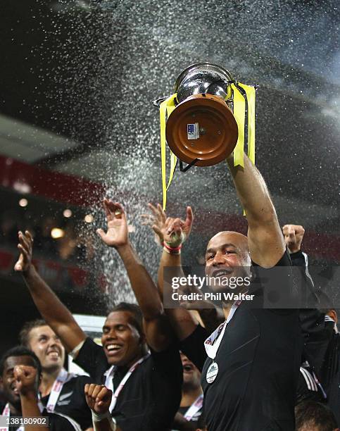 New Zealand captain DJ Forbes holds up the trophy after winning the Cup Final against Fiji on day two of the Wellington Sevens at Westpac Stadium on...