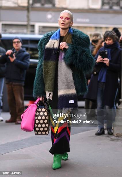 Model Kristen McMenamy is seen wearing a faux green coat, Hermes scarf and red eye shadow outside the Valentino show during Paris Fashion Week A/W...