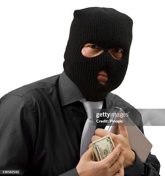 geschäftsmann stehlen geld und daten mit balaclava - skimaske stock-fotos und bilder
