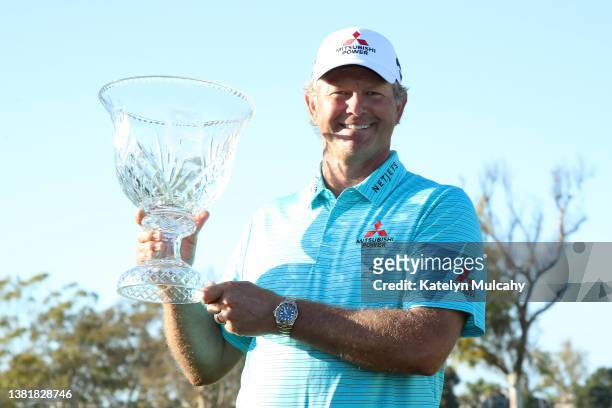 Retief Goosen of South Africa poses with the winner's trophy during the final round at Newport Beach Country Club on March 06, 2022 in Newport Beach,...