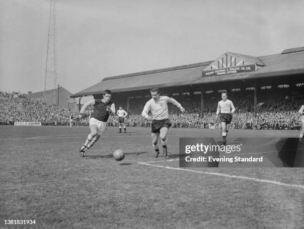 Footballer Alan Mullery of Fulham and Ronnie Boyce of West Ham United during a League Division One match at Craven Cottage in London, UK, 6th April...