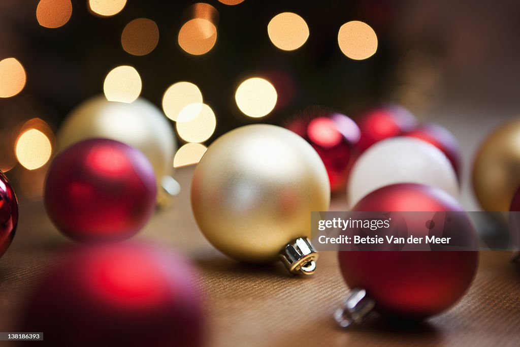 Christmas baubles on table.