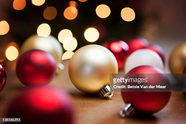 christmas baubles on table. - christmas ornament stock pictures, royalty-free photos & images