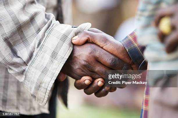 two men shaking hands, ethiopia - piper mackay stock pictures, royalty-free photos & images
