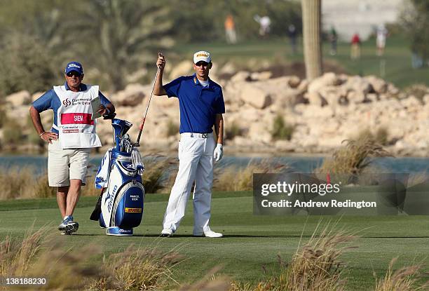 Marcel Siem of Germany stands with his caddie Kyle Roadley during the second round of the Commercialbank Qatar Masters held at Doha Golf Club on...