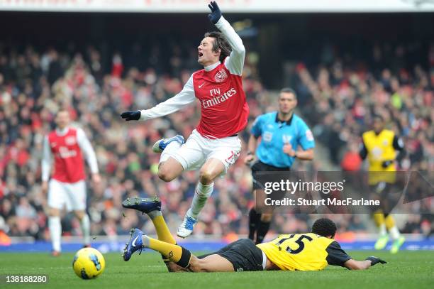 Tomas Rosicky of Arsenal is fouled by Blackburn's Steven Nzonzi during the Barclays Premier League match between Arsenal and Blackburn Rovers at...