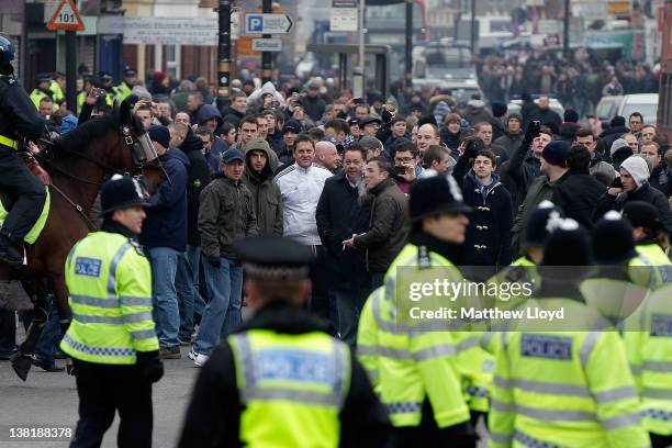 West Ham fans are escorted by police towards the stadium before the npower Championship match between West Ham United and Millwall, at Boleyn Ground...