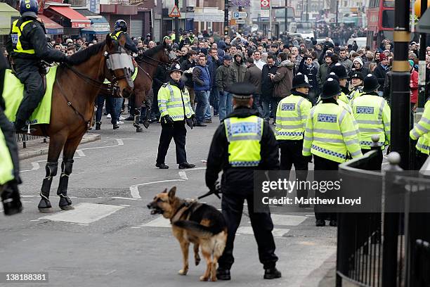 West Ham fans are escorted by police towards the stadium before the npower Championship match between West Ham United and Millwall, at Boleyn Ground...