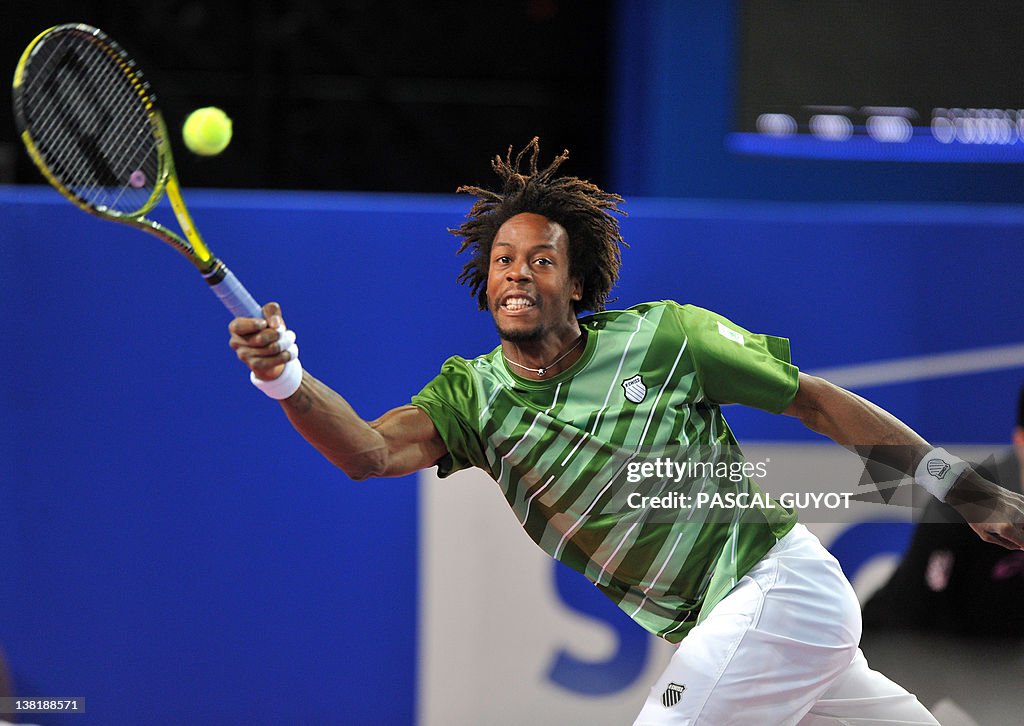 French Gael Monfils returns the ball to