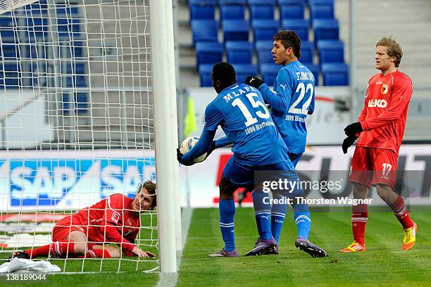 Peniel Mlapa of Hoffenheim is scoring his teams first goal during the Bundesliga match between TSG 1899 Hoffenheim and FC Augsburg at...