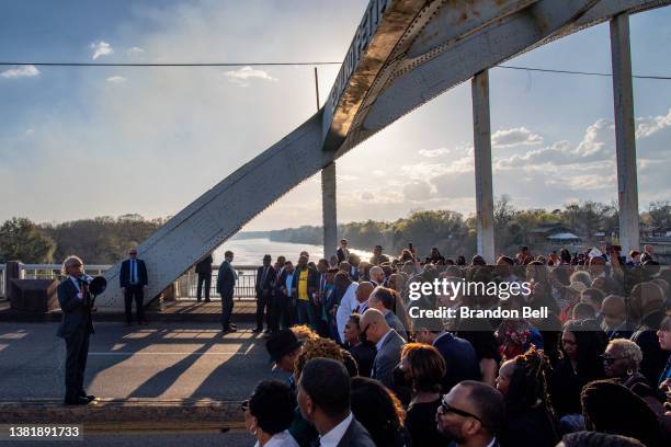 The Rev. Al Sharpton prepares marchers for a prayer on the Edmund Pettus Bridge during commemorations for the 57th anniversary of "Bloody Sunday" on...