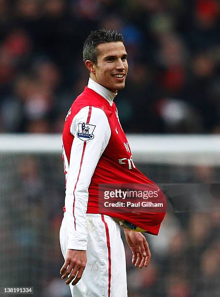 Robin van Persie walks off the pitch after Arsenal won 7-1 during the Barclays Premier League match between Arsenal and Blackburn Rovers at Emirates...