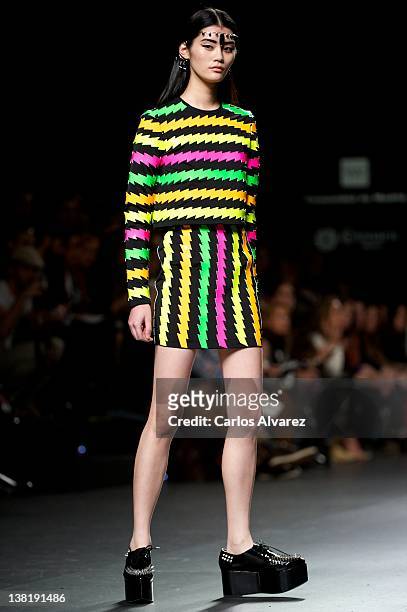 Model walks the runway in the Maria Escote fashion show during the Mercedes-Benz Fashion Week Madrid Autumn/Winter 2012 at Ifema on February 4, 2012...
