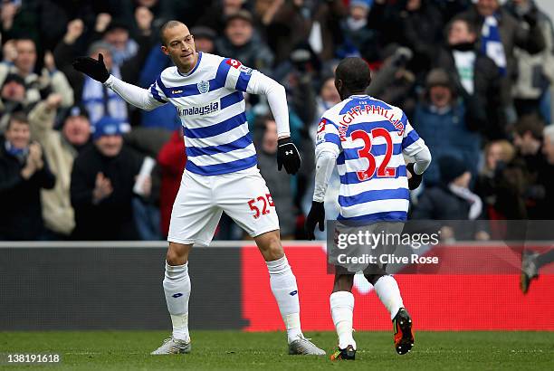 Bobby Zamora of Queens Park Rangers celebrates scoring the opening goal with teammate Shaun Wright-Phillips during the Barclays Premier League match...