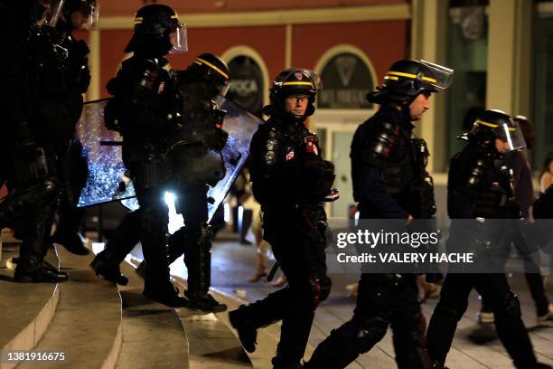 Riot police personnel patrol on a street in Nice, south-eastern France late July 1 during the fifth night of rioting following the shooting of a...