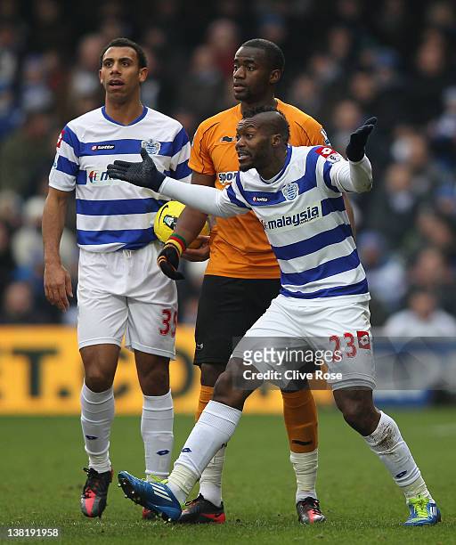 Djibril Cisse of Queens Park Rangers reacts after he is shown a red card by referee Mark Clattenburg during the Barclays Premier League match between...