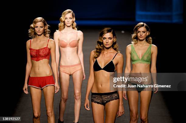 Models walk the runway in the TCN fashion show during the Mercedes-Benz Fashion Week Madrid Autumn/Winter 2012 on February 4, 2012 in Madrid, Spain.