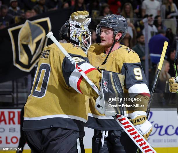 Robin Lehner and Jack Eichel of the Vegas Golden Knights celebrate on the ice after the team's 2-1 victory over the Ottawa Senators at T-Mobile Arena...