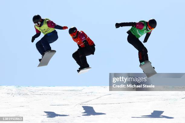James Barnes-Miller of Team Great Britain , Yonggang Zhu of Team China and Lijia Ji of Team China compete in the Men's Snowboard Cross SB-UL...