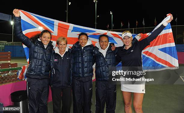 Great Britain team, Laura Robson, captain Judy Murray, Anne Keothavong, Heather Watson and Elane Baltacha celebrate winning the tie between Great...