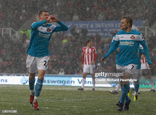 James McClean of Sunderland celebrates scoring the first goal during the Barclays Premier League match between Stoke City and Sunderland at the...