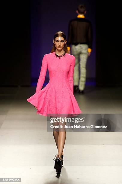 Model walks the runway in the Maria Escote fashion show during the Mercedes-Benz Fashion Week Madrid Autumn/Winter 2012 at Ifema on February 4, 2012...