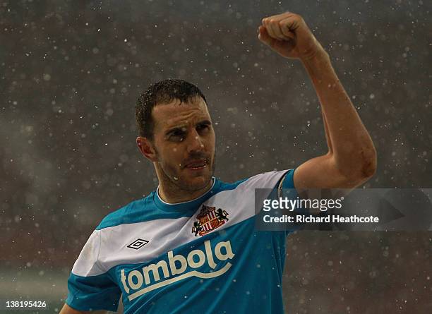 John O'Shea of Sunderland applaudes the fans at the end of the game during the Barclays Premier League match between Stoke City and Sunderland at the...