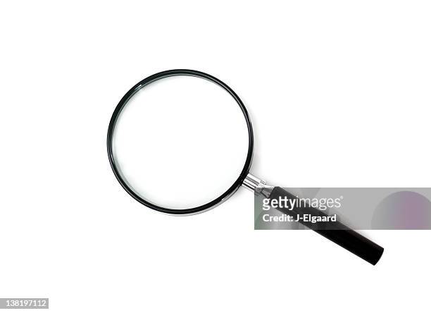 black magnifying glass on a white background - magnifying glass stock pictures, royalty-free photos & images