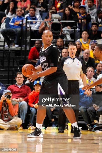 Chuck Hayes of the Sacramento Kings looks to pass the ball against the Golden State Warriors on January 31, 2012 at Oracle Arena in Oakland,...