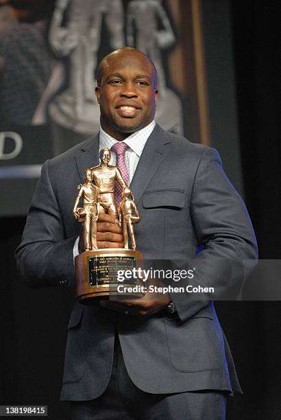 London Fletcher accepts the Bart Starr Award durings the 25th Annual Super Bowl Breakfast at Exposition Hall at the Indiana State Fairgrounds on...