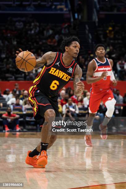 Lou Williams of the Atlanta Hawks brings the ball up court against the Washington Wizards during the first half at Capital One Arena on March 4, 2022...