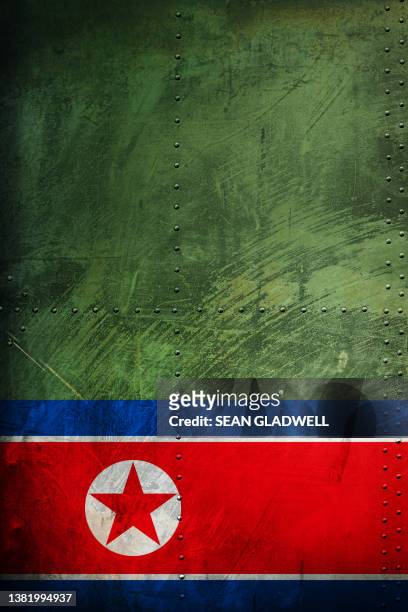 north korean flag on armoured steel - heavy metal poster stock pictures, royalty-free photos & images