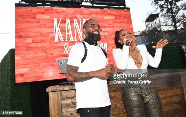 Todd Tucker and Kandi Burruss speak onstage during the premiere of "Kandi & The Gang" series celebration at Old Lady Gang Southern Cuisine on March...