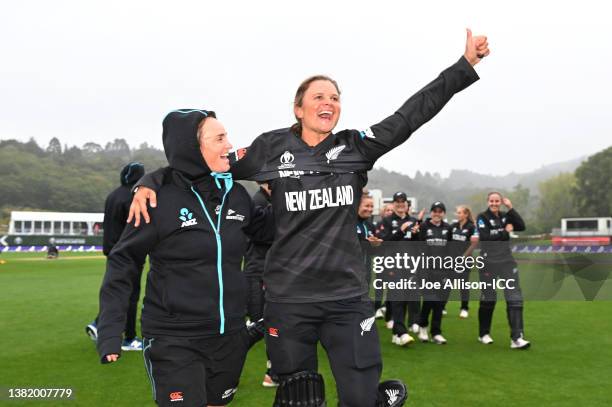Katey Martin and Suzie Bates of New Zealand celebrate after winning the 2022 ICC Women's Cricket World Cup match between New Zealand and Bangladesh...
