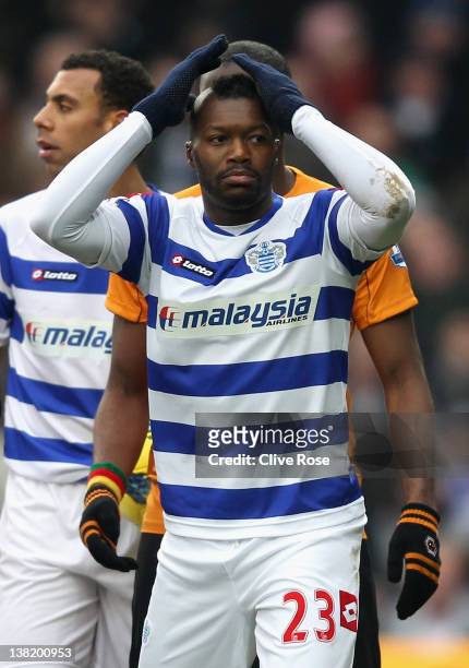Djibril Cisse of Queens Park Rangers looks on in disbelief after he is shown a red card by referee Mark Clattenburg during the Barclays Premier...