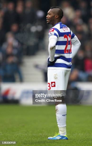 Djibril Cisse of Queens Park Rangers looks on in disbelief after he is shown a red card by referee Mark Clattenburg during the Barclays Premier...