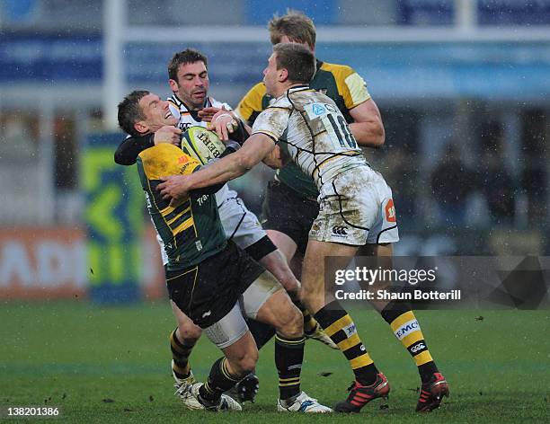 Tom May of Northampton Saints is tackled by Will Robinson of London Wasps during the LV= Cup match between Northampton Saints and London Wasps at...