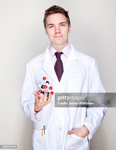 young male scientist - clean suit stock pictures, royalty-free photos & images