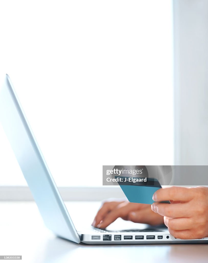 Cropped image of a woman online shopping