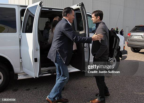 Republican presidential candidate former Massachusetts Gov. Mitt Romney embraces his son Matt Romney after arriving at the airport for a campaign...