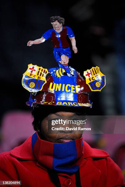 Barcelona supporter wears a FC Barcelona customised hat during the La Liga match between FC Barcelona and Real Sociedad de Futbol at Camp Nou on...