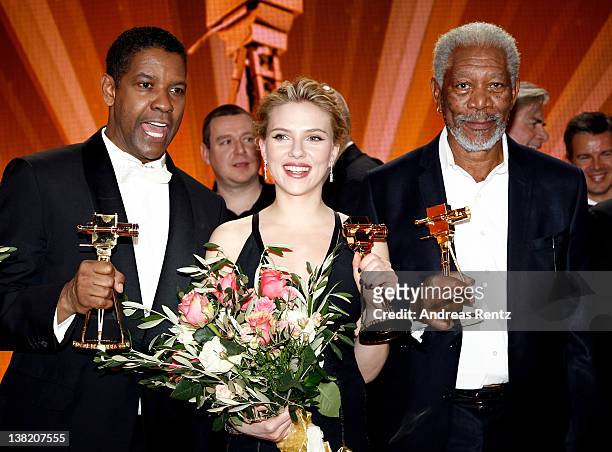 Denzel Washington, Scarlett Johansson and Morgan Freeman pose with their Goldene Kamera awards during the 47th Golden Camera Awards at the Axel...