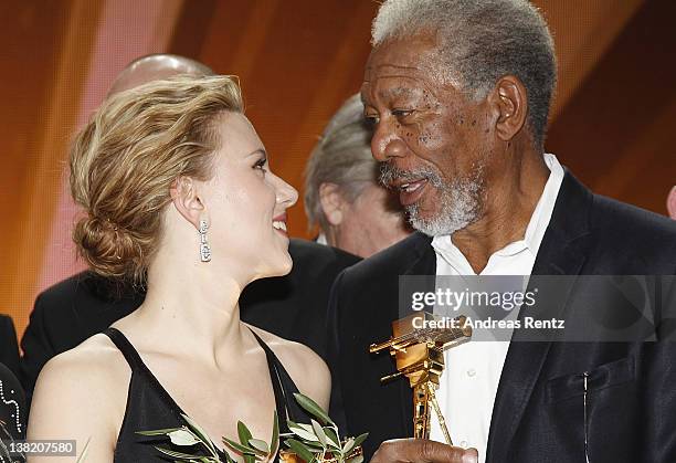 Scarlett Johansson and Morgan Freeman pose for a final picture at the 47th Golden Camera Awards at the Axel Springer Haus on February 4, 2012 in...