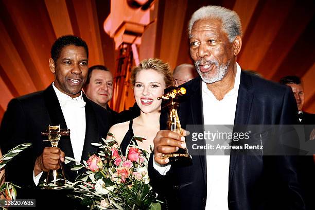 Denzel Washington, Scarlett Johansson and Morgan Freeman pose with their Goldene Kamera awards during the 47th Golden Camera Awards at the Axel...