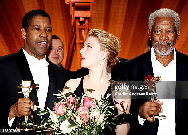 Denzel Washington, Scarlett Johansson and Morgan Freeman pose with their Goldene Kamera awards during the 47th Golden Camera Awards at the Axel...